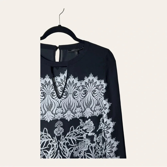 0755. BCBGMAXAZRIA LONG SLEEVE BLOUSE SIZE SMALL BLACK AND WHITE IN COLOR FLORAL - Picture 3 of 9